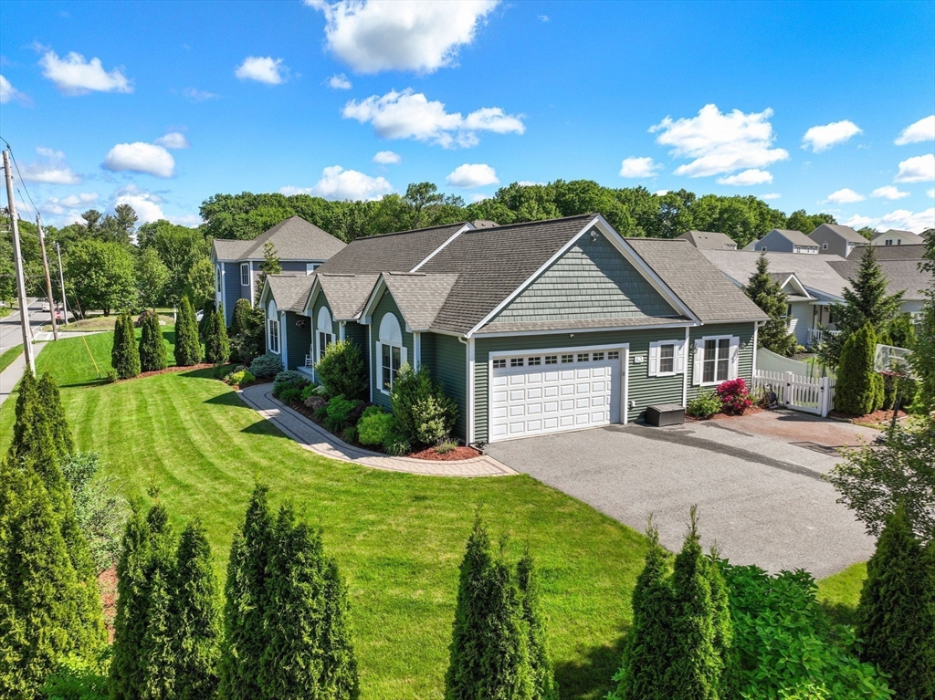 63 Vista Circle Holden, MA 01520 - Photo 2 of 36 a front view of a house with yard and green space