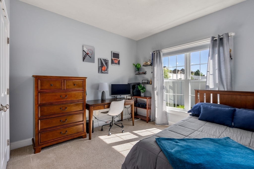 63 Vista Circle Holden, MA 01520 - Photo 24 of 36 a bedroom with a bed and a window
