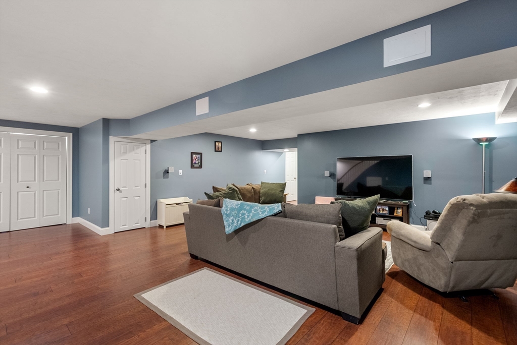 63 Vista Circle Holden, MA 01520 - Photo 26 of 36 a living room with furniture and a flat screen tv