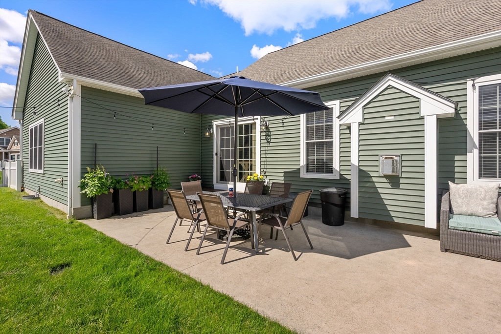 63 Vista Circle Holden, MA 01520 - Photo 30 of 36 a view of a house with patio and a yard