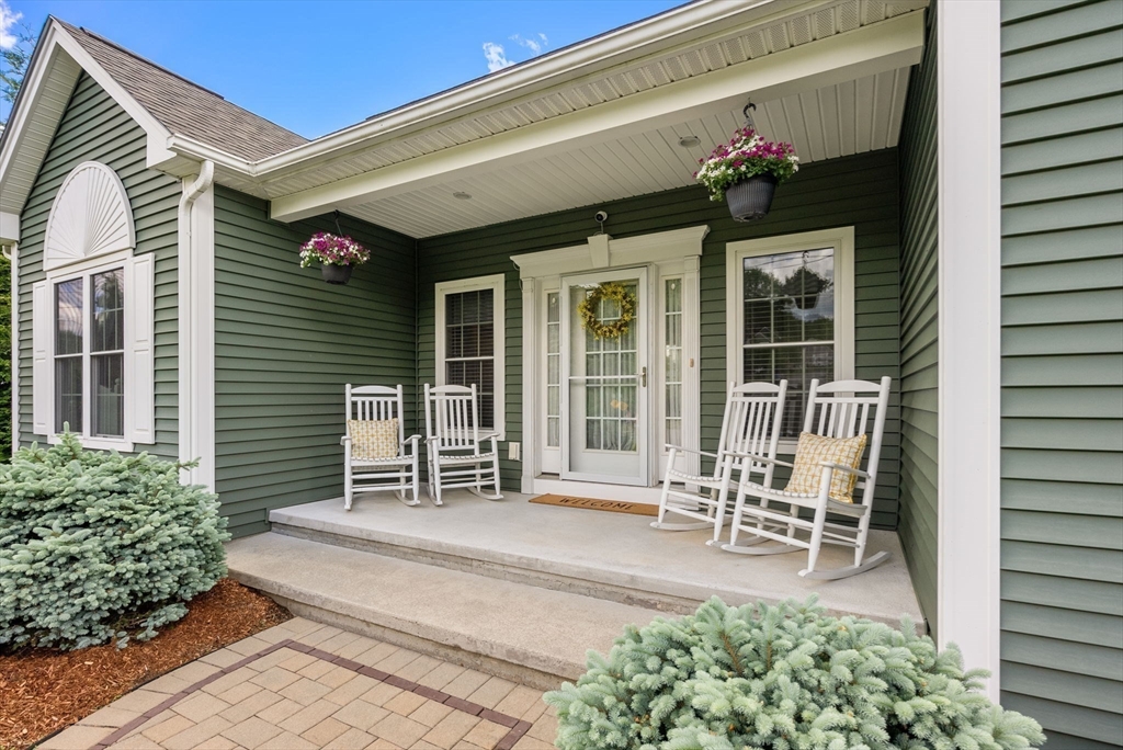 63 Vista Circle Holden, MA 01520 - Photo 3 of 36 a house view with a seating space and garden space