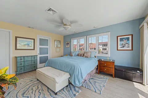 a bedroom with a bed and a dresser in it