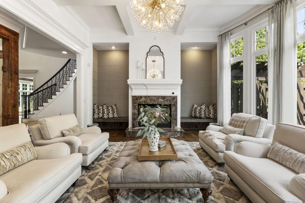 2810 Manor Bridge Drive Milton, GA 30004 - Photo 18 of 70 a living room with furniture a large window and a fireplace