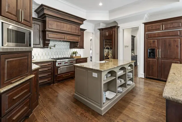 a dining room with furniture and a potted plant