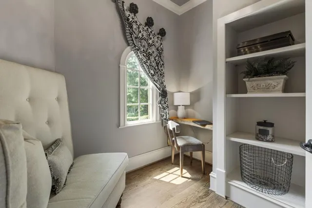 a view of entryway and hall with a living room