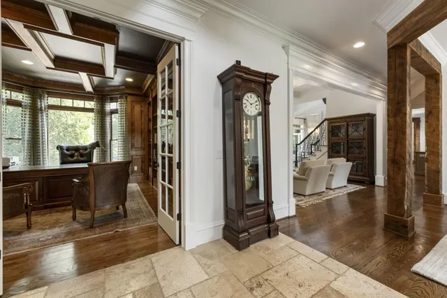 a living room with fireplace furniture and a flat screen tv