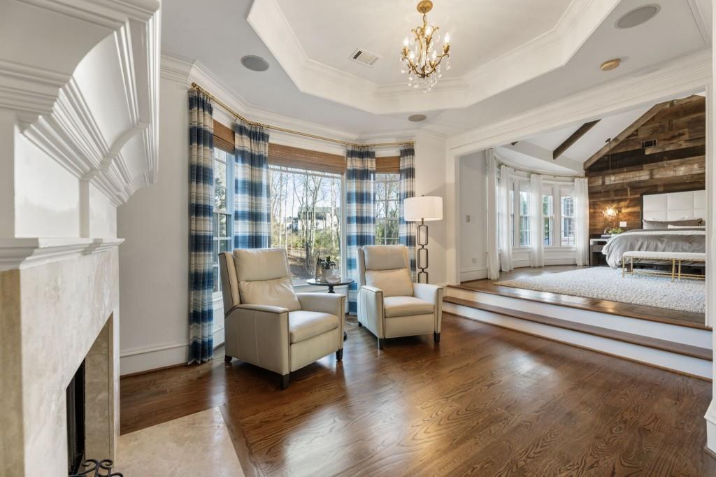 2810 Manor Bridge Drive Milton, GA 30004 - Photo 41 of 70 a living room with furniture and a chandelier