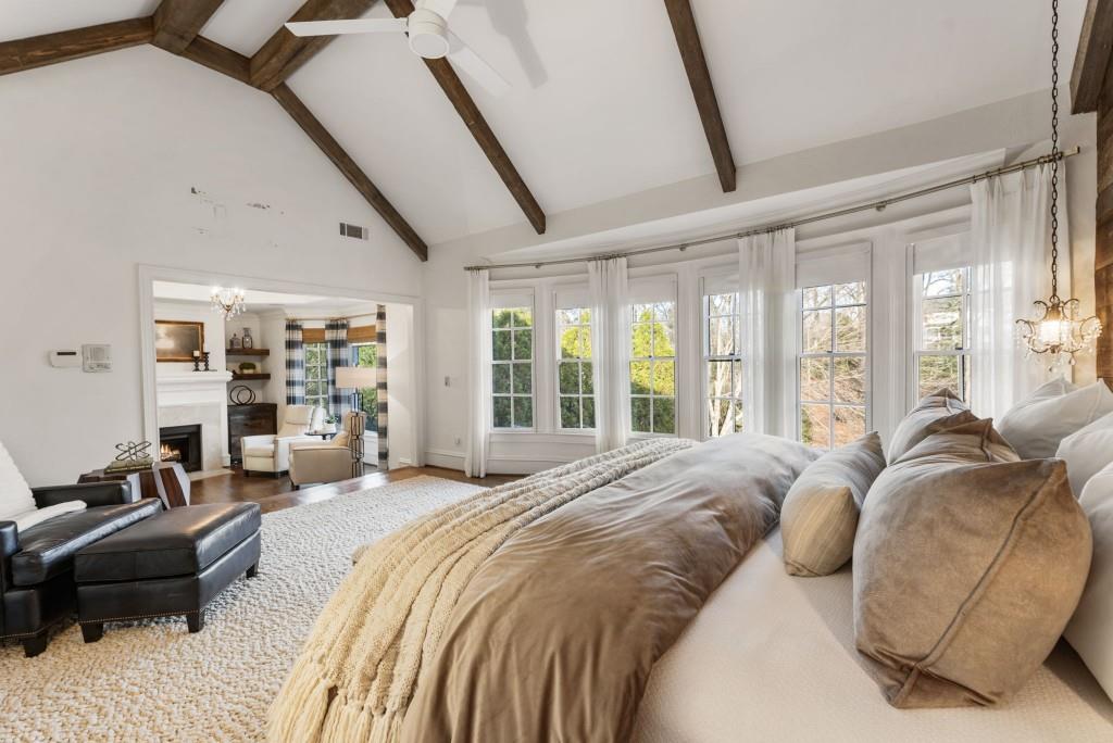 2810 Manor Bridge Drive Milton, GA 30004 - Photo 45 of 70 a spacious bedroom with a bed a couch and large windows