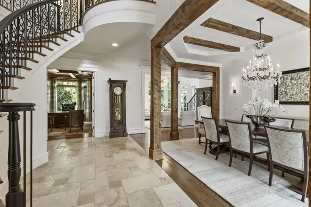 a living room with furniture and a piano