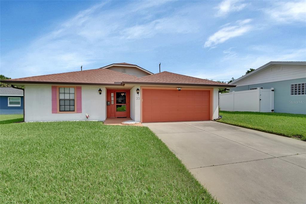 33 Rivocean Drive Ormond Beach, FL 32176 - Photo 1 of 31 a front view of a house with yard