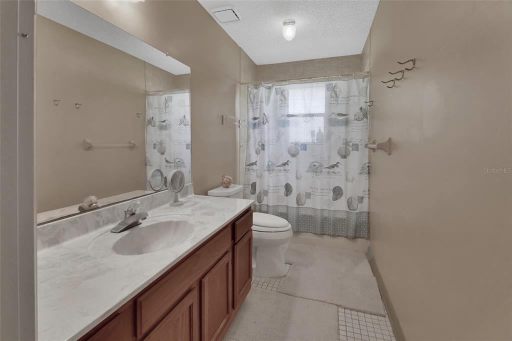 33 Rivocean Drive Ormond Beach, FL 32176 - Photo 11 of 31 a bathroom with a sink a toilet and shower