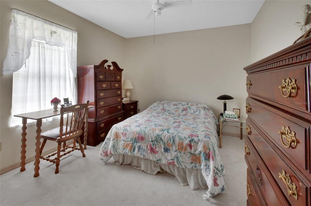 33 Rivocean Drive Ormond Beach, FL 32176 - Photo 12 of 31 a bedroom with a bed and a furniture