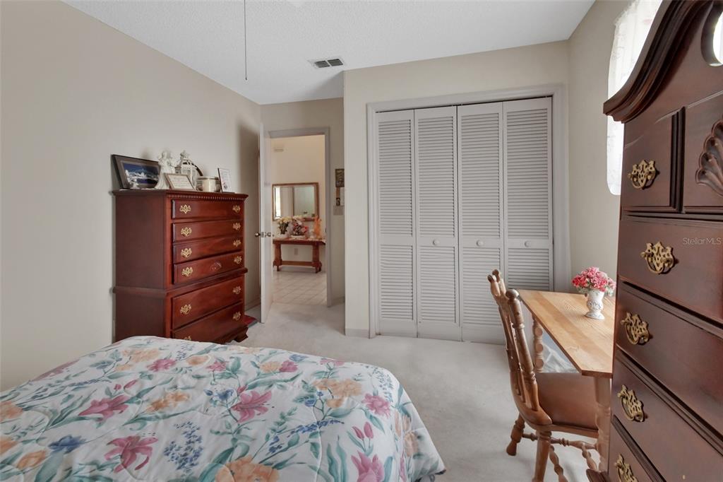 33 Rivocean Drive Ormond Beach, FL 32176 - Photo 13 of 31 a bedroom with a bed and furniture