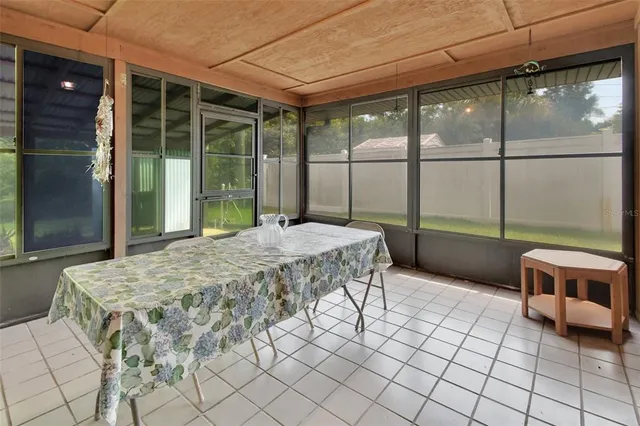 a bedroom with a bed and glass door