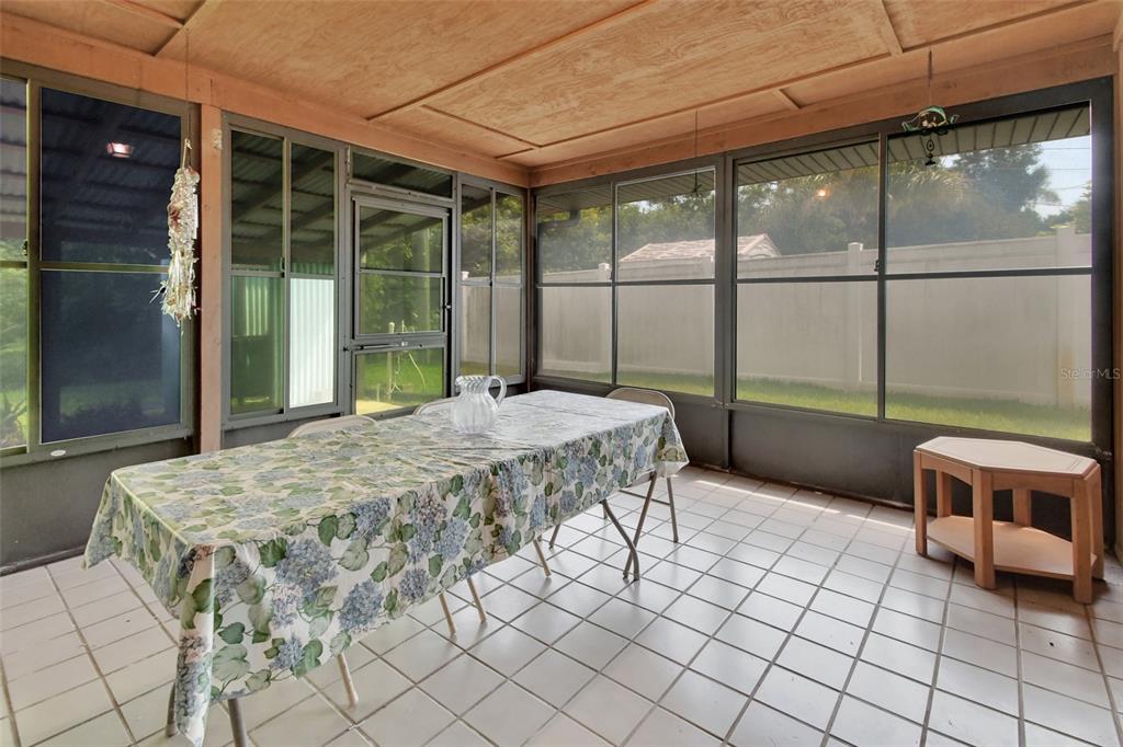 33 Rivocean Drive Ormond Beach, FL 32176 - Photo 15 of 31 a bedroom with a bed and glass door