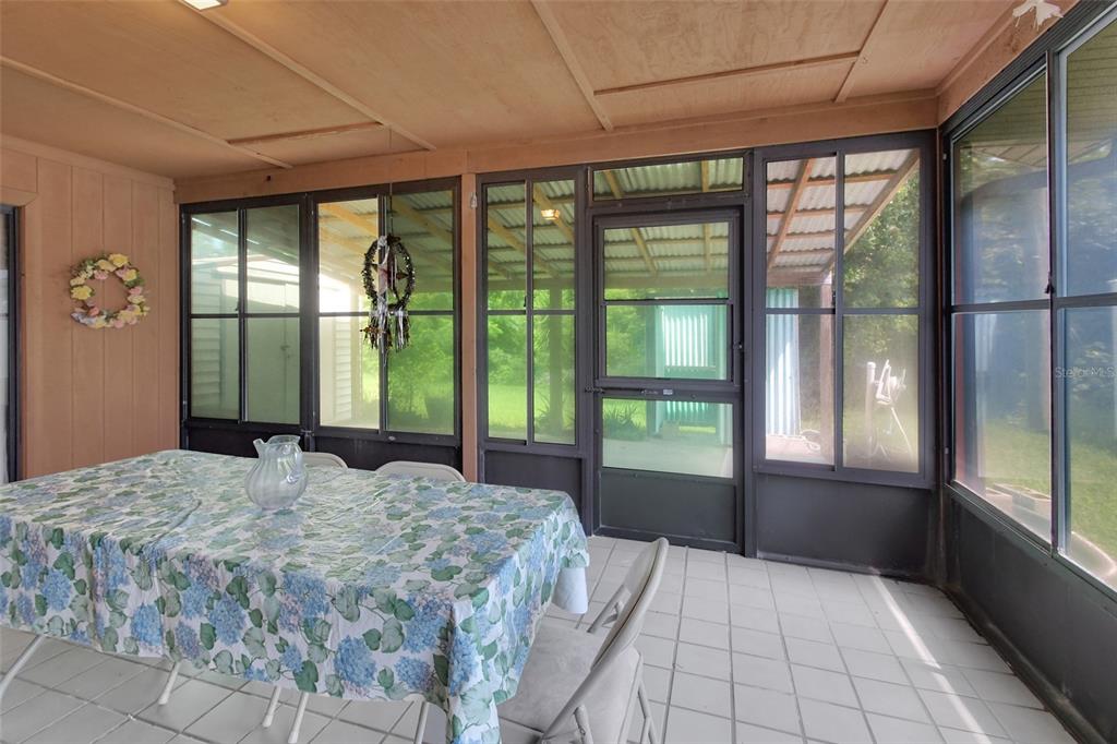 33 Rivocean Drive Ormond Beach, FL 32176 - Photo 17 of 31 a bedroom with a large bed and a large window