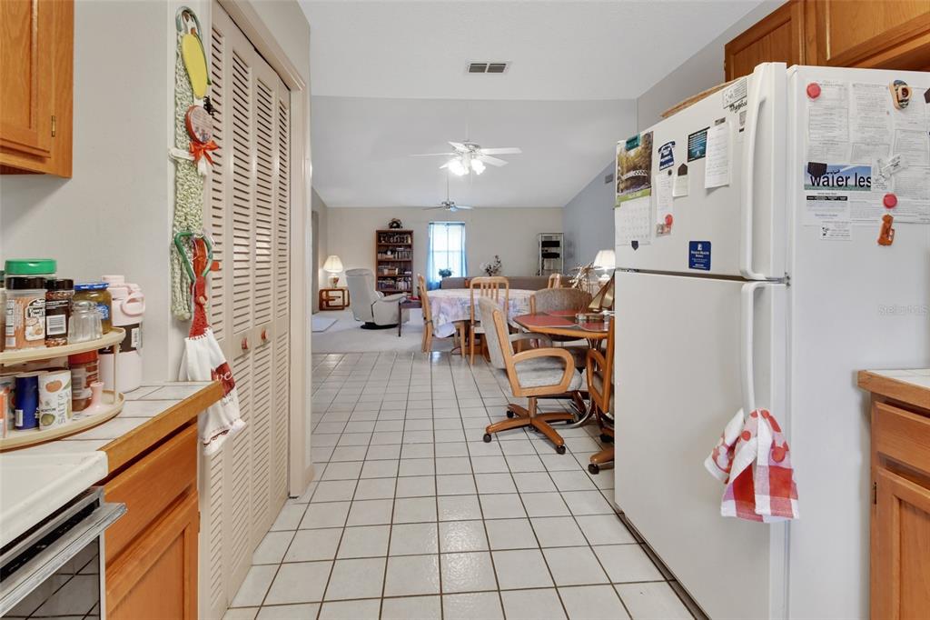 33 Rivocean Drive Ormond Beach, FL 32176 - Photo 6 of 31 a open kitchen with a refrigerator and a sink