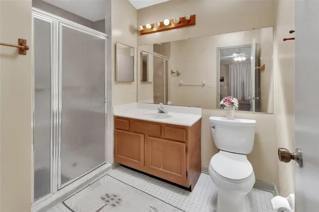 a bathroom with a toilet sink and shower