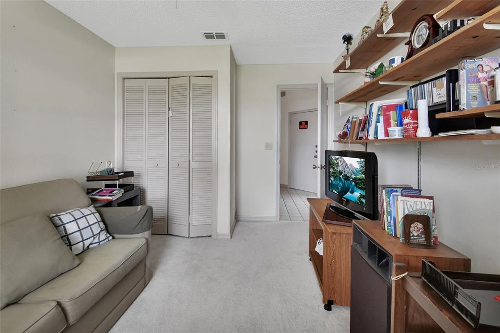 33 Rivocean Drive Ormond Beach, FL 32176 - Photo 10 of 31 a living room with furniture and a flat screen tv