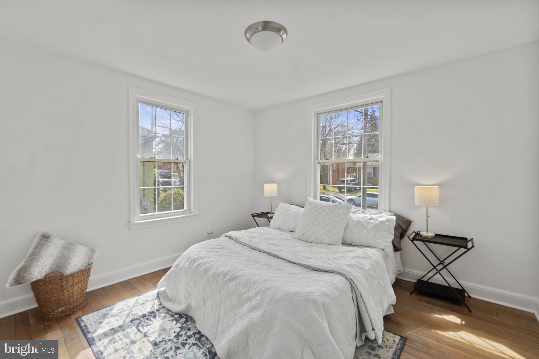 9123 Bradford Road Silver Spring, MD 20901 - Photo 11 of 22 a bedroom with a bed and window