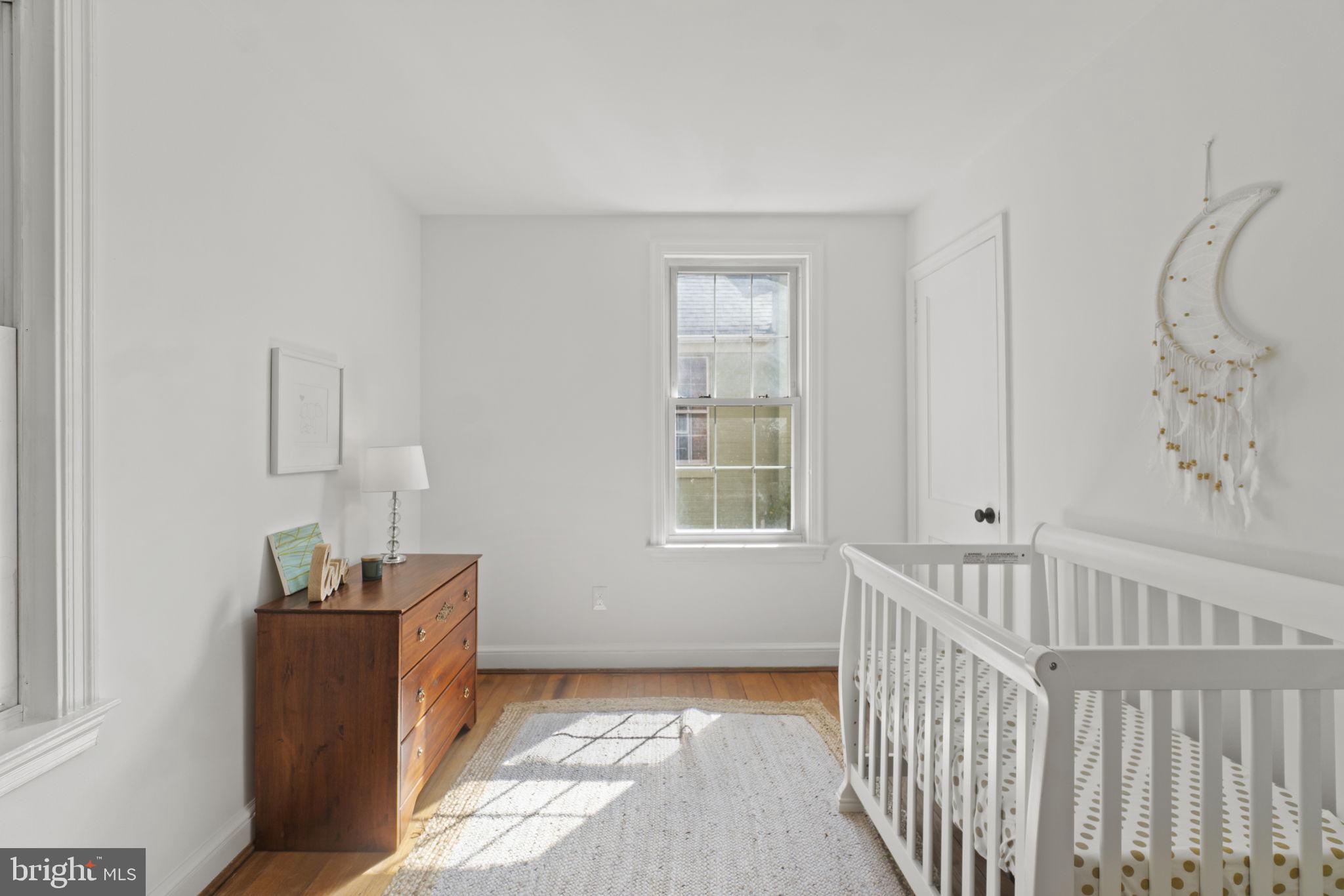 9123 Bradford Road Silver Spring, MD 20901 - Photo 12 of 22 a bedroom with furniture and window