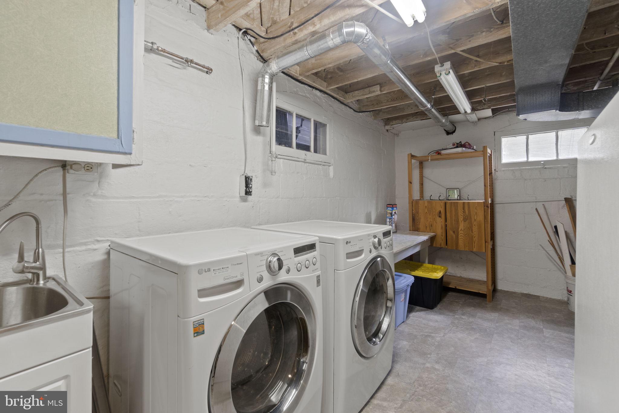 9123 Bradford Road Silver Spring, MD 20901 - Photo 17 of 22 a utility room with dryer and washer