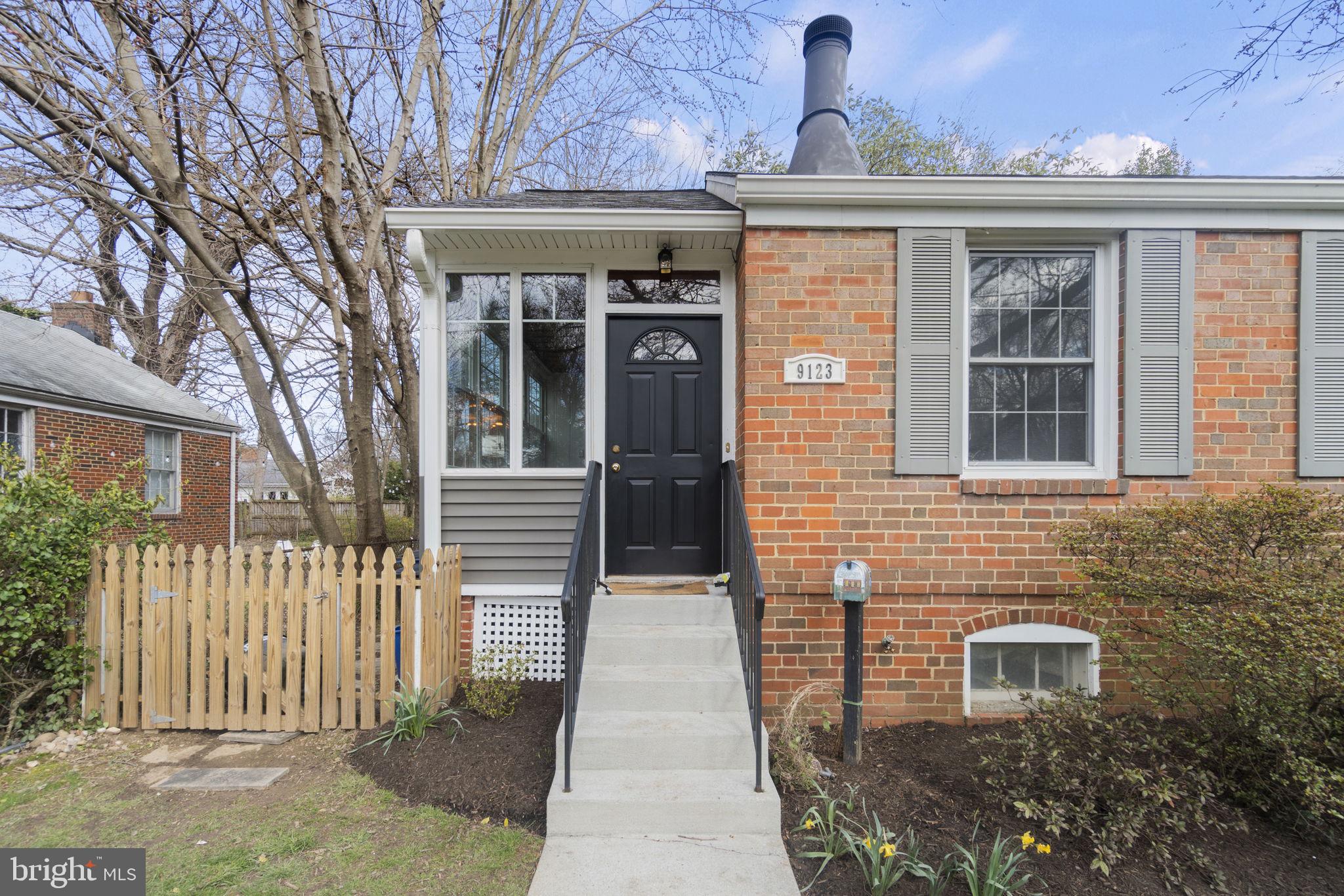 9123 Bradford Road Silver Spring, MD 20901 - Photo 2 of 22 a front view of a house with a yard