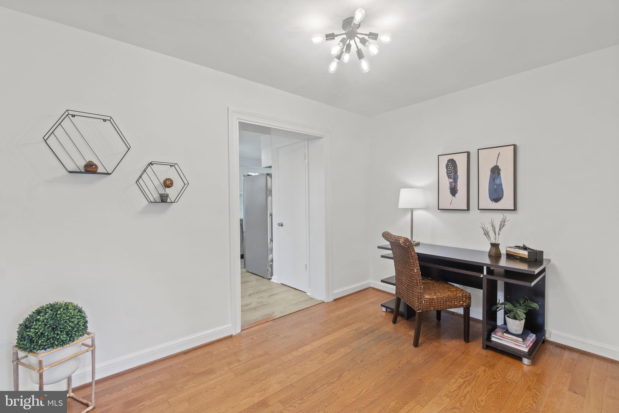 9123 Bradford Road Silver Spring, MD 20901 - Photo 8 of 22 a view of a room with furniture and wooden floor