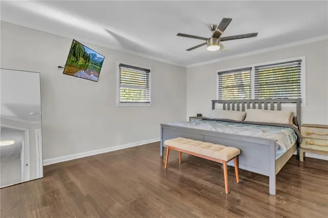 a bedroom with a bed and a table