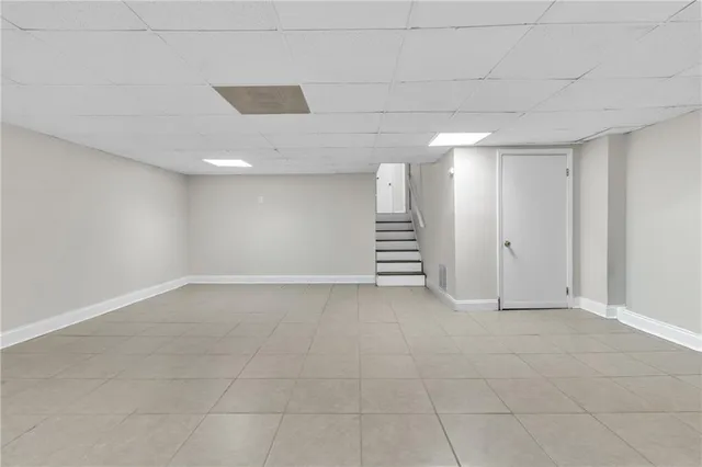a view of an empty room with stairs