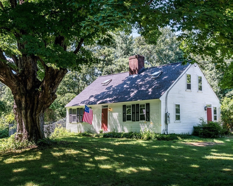 36 Patten Road Merrimack, NH 03054 - Photo 2 of 32 a front view of a house with a garden