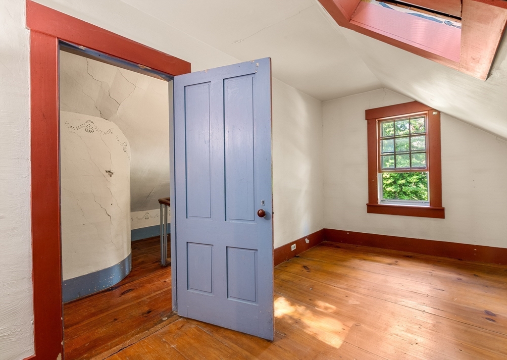 36 Patten Road Merrimack, NH 03054 - Photo 24 of 32 an empty room with window and wooden floor