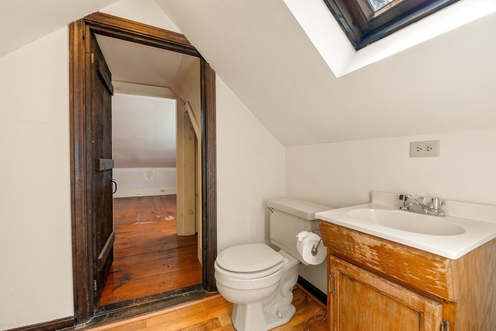 36 Patten Road Merrimack, NH 03054 - Photo 26 of 32 a bathroom with a sink a toilet and shower