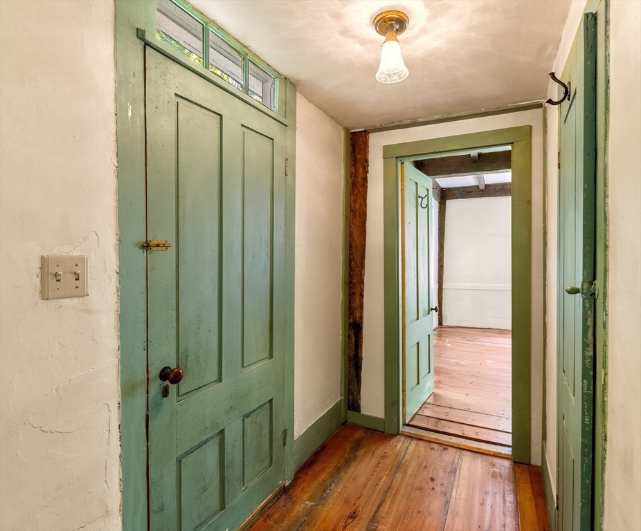 36 Patten Road Merrimack, NH 03054 - Photo 6 of 32 a view of a hallway with wooden floor and staircase