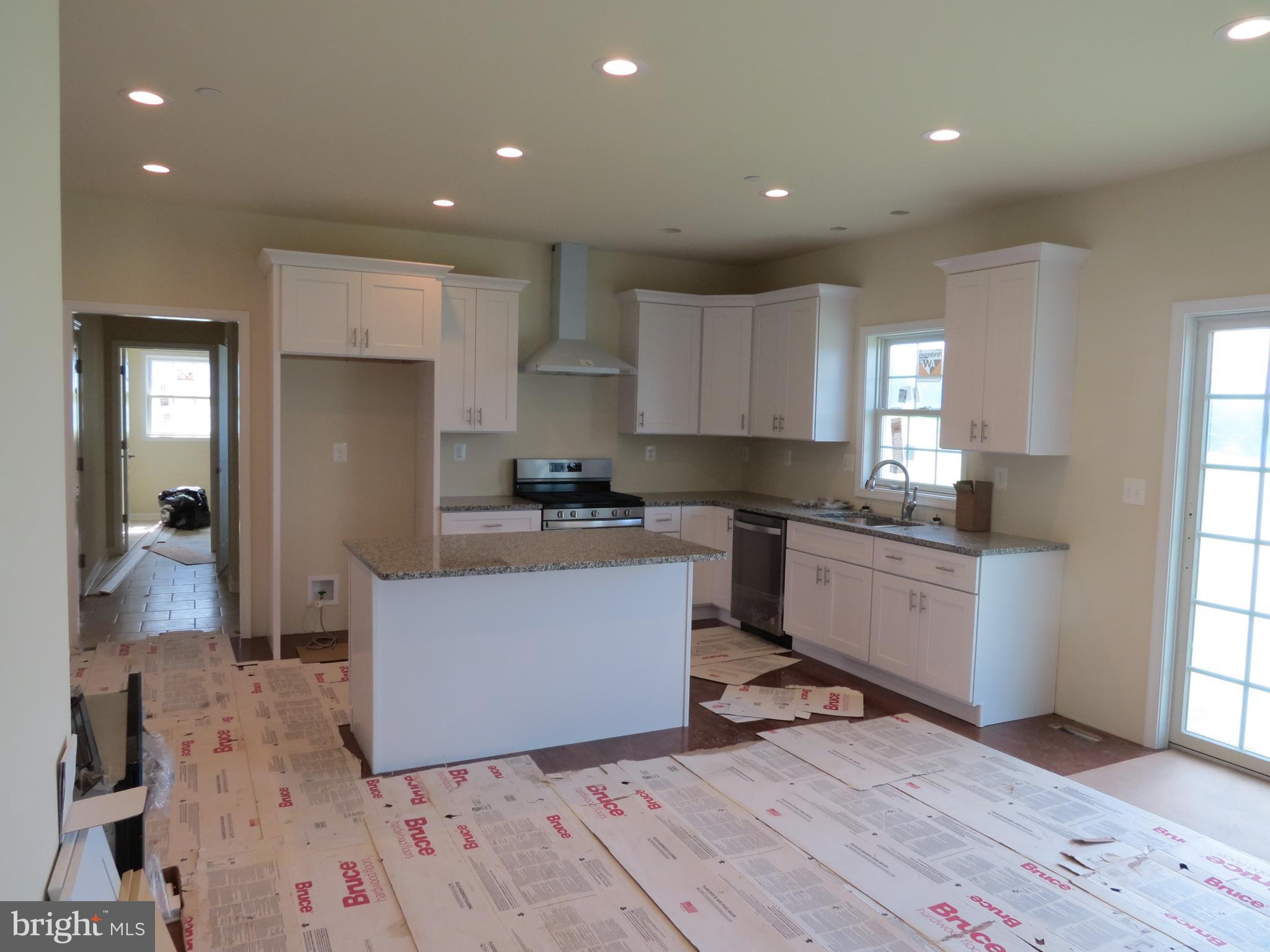 41 Wind Ridge Road Mount Airy, MD 21771 - Photo 7 of 30 Kitchen HW floors stove pipe hood vent