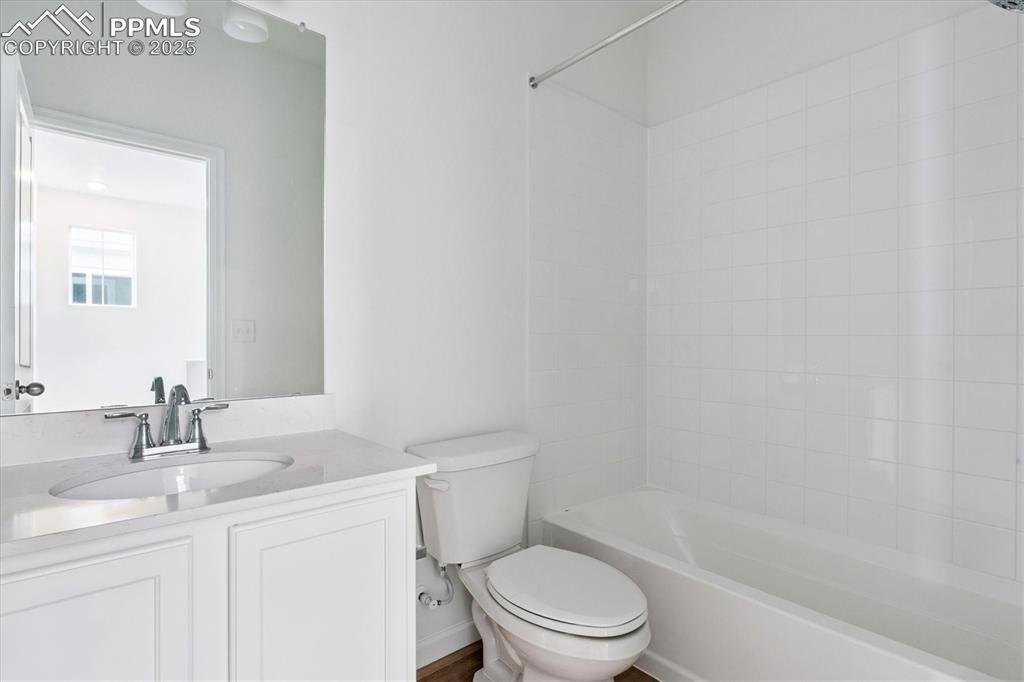2444 Serviceberry Grove Colorado Springs, CO 80915 - Photo 13 of 21 a bathroom with a sink a toilet and shower