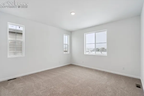 an empty room with windows