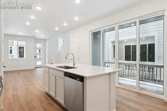 a kitchen with a sink and large window