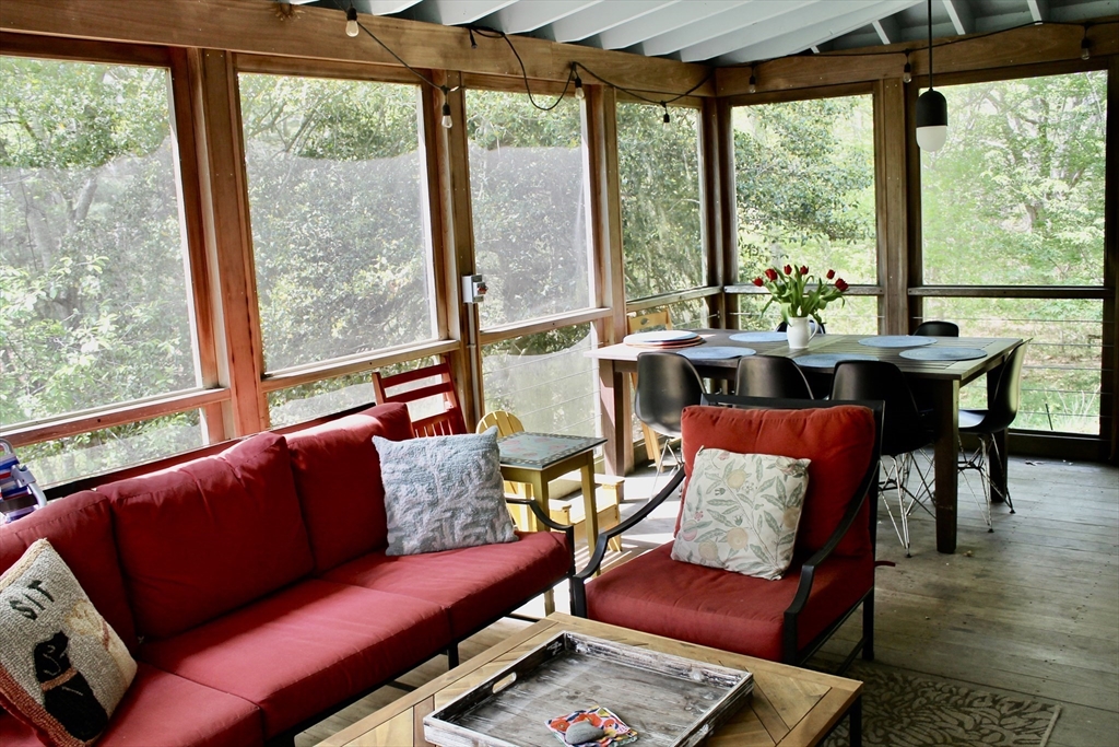 225 Lamberts Cove Road West Tisbury, MA 02568 - Photo 29 of 33 a living room with furniture and a large window