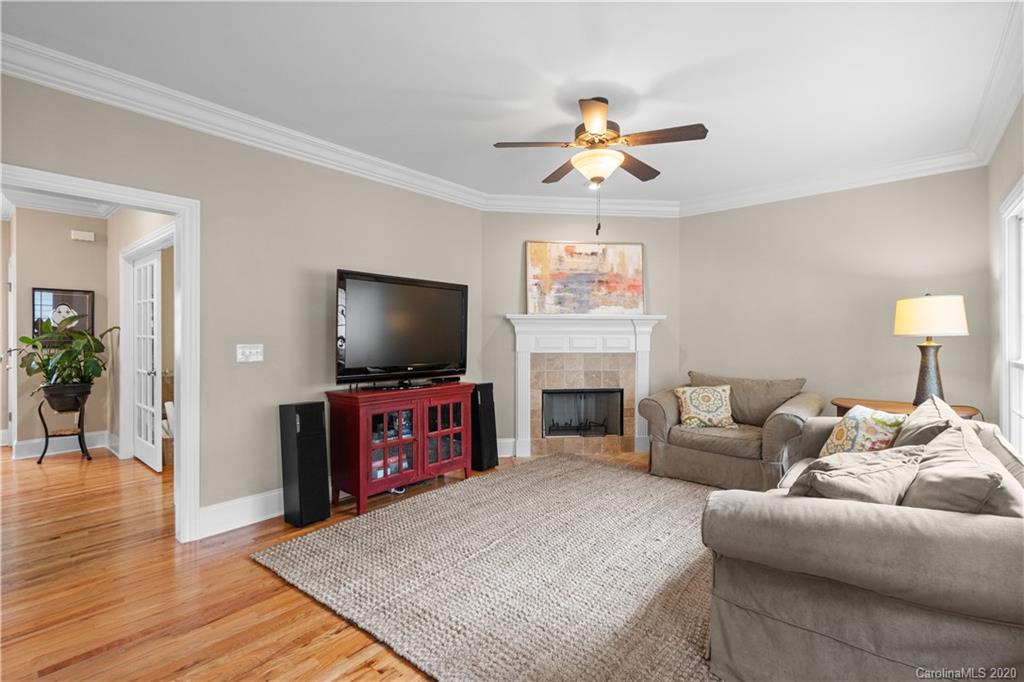 809 Millbrook Road Charlotte, NC 28211 - Photo 14 of 31 a living room with furniture and a flat screen tv