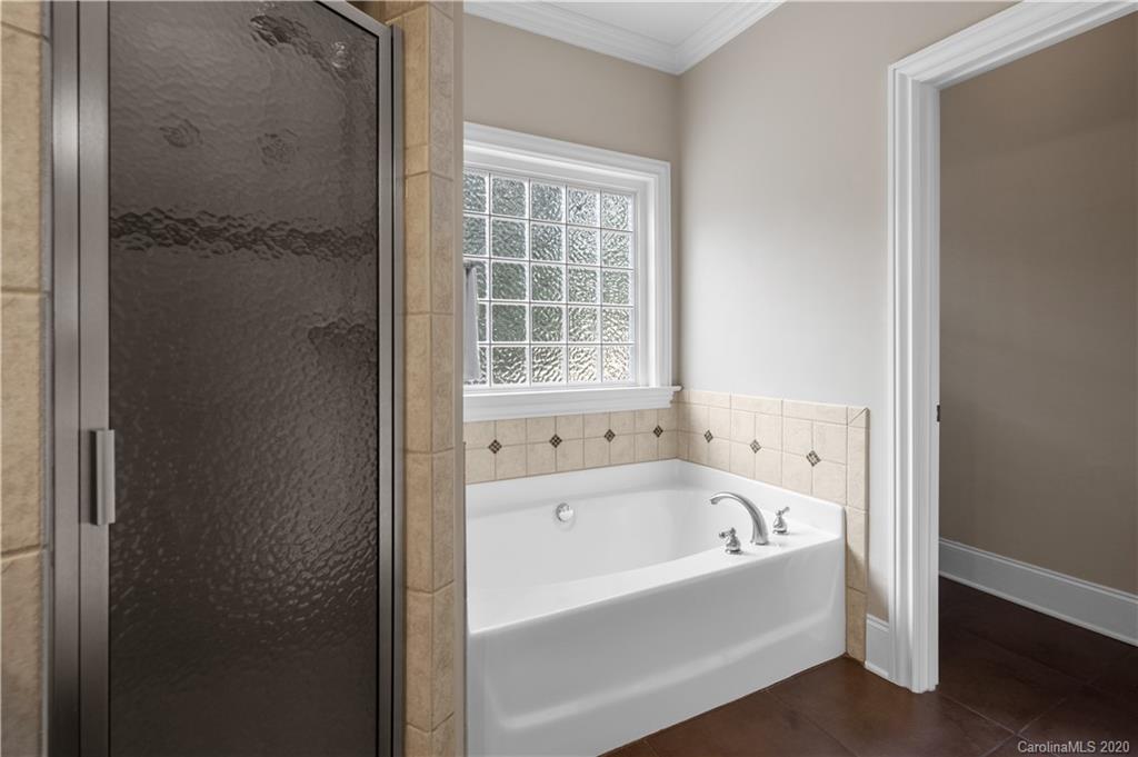 809 Millbrook Road Charlotte, NC 28211 - Photo 22 of 31 a white bath tub sitting next to a window