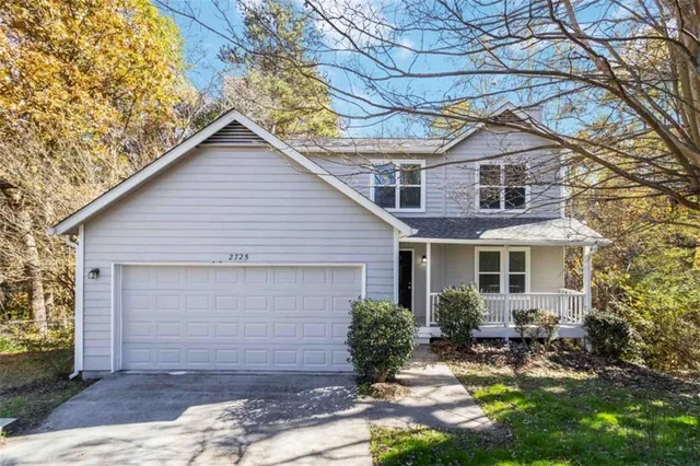 a backyard of a house with yard and outdoor seating