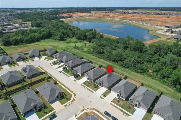 an aerial view of a house with a lake view