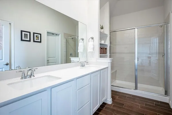 a bathroom with a granite countertop sink mirror and double