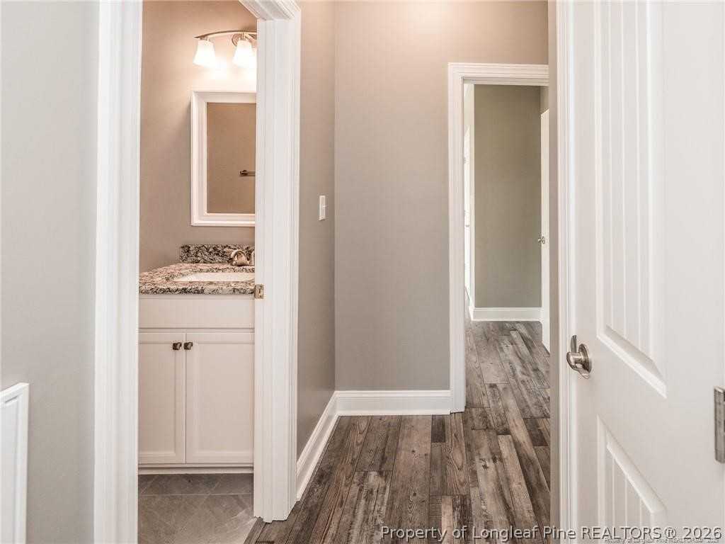 1102 West Carthage Road Lumberton, NC 28360 - Photo 29 of 41 a bathroom with a sink and a mirror