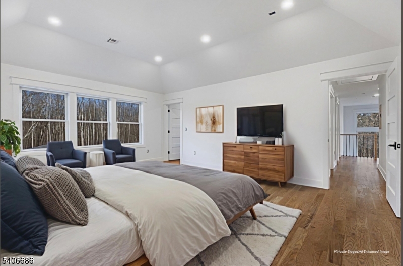 759 Mechlin Corner Road Hampton, NJ 08827 - Photo 25 of 45 a bedroom with a bed and a flat screen tv