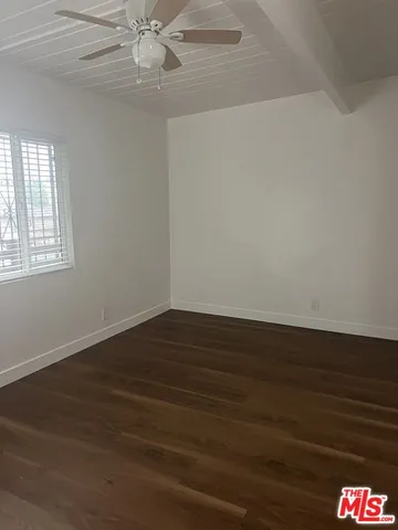 a kitchen with granite countertop a stove a sink and dishwasher