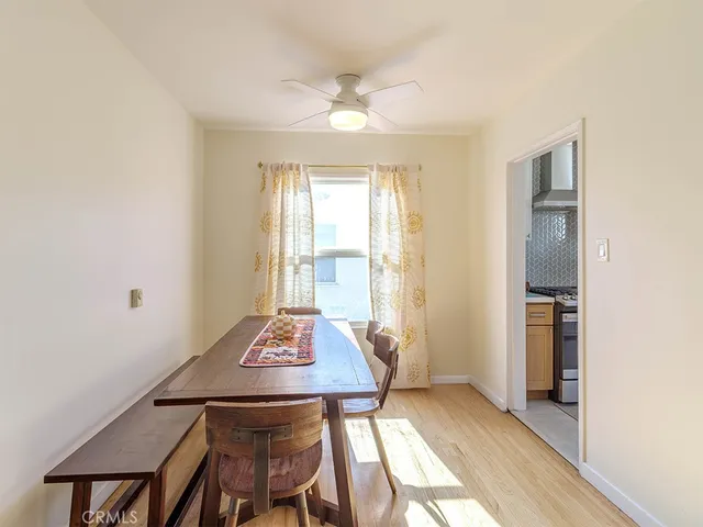 a view of a dining room with furniture and window