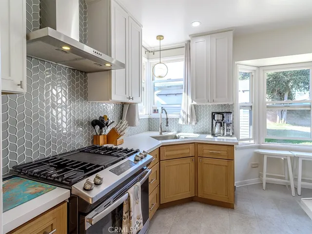 a kitchen with a stove and a sink