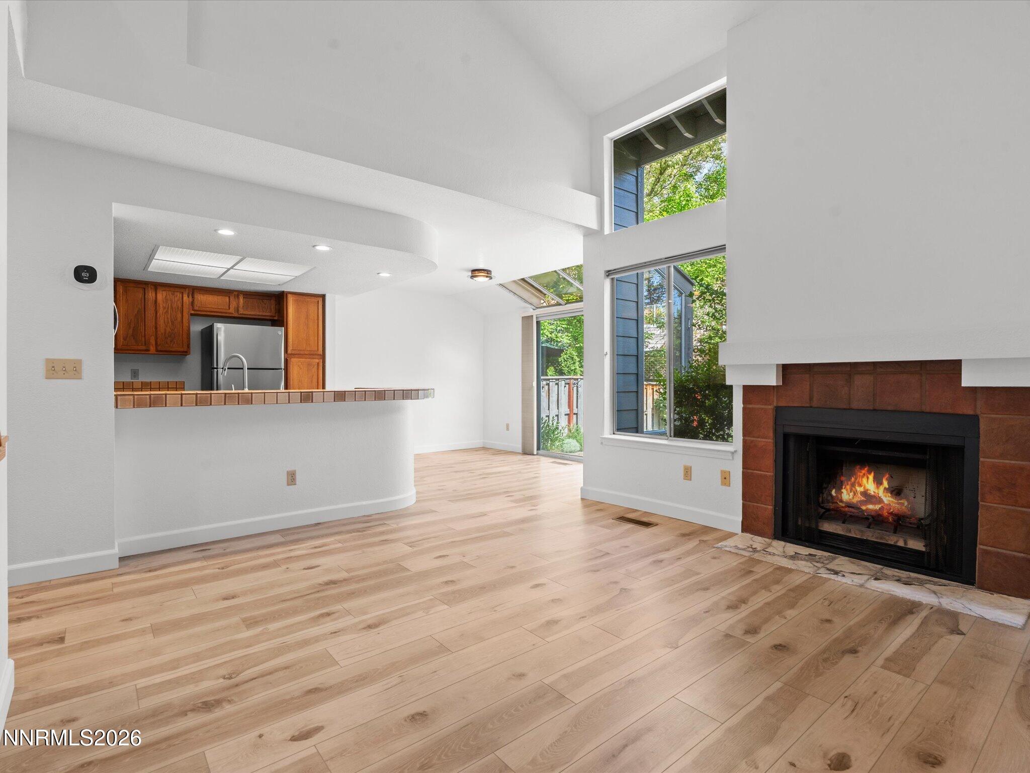 3170 Oakshire Court Reno, NV 89509 - Photo 12 of 43 a view of an empty room with a fireplace and a window
